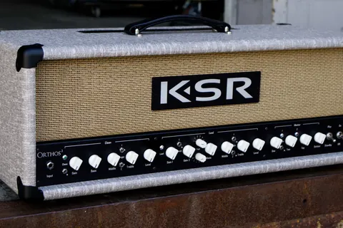 Tube amplifier head in cream tolex with wheat grille cloth, on the loading dock