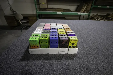 Rows of pedal enclosures finished in bright colors