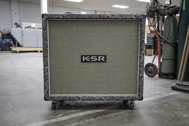 Black snakeskin 2&times;12 speaker cabinet in the warehouse